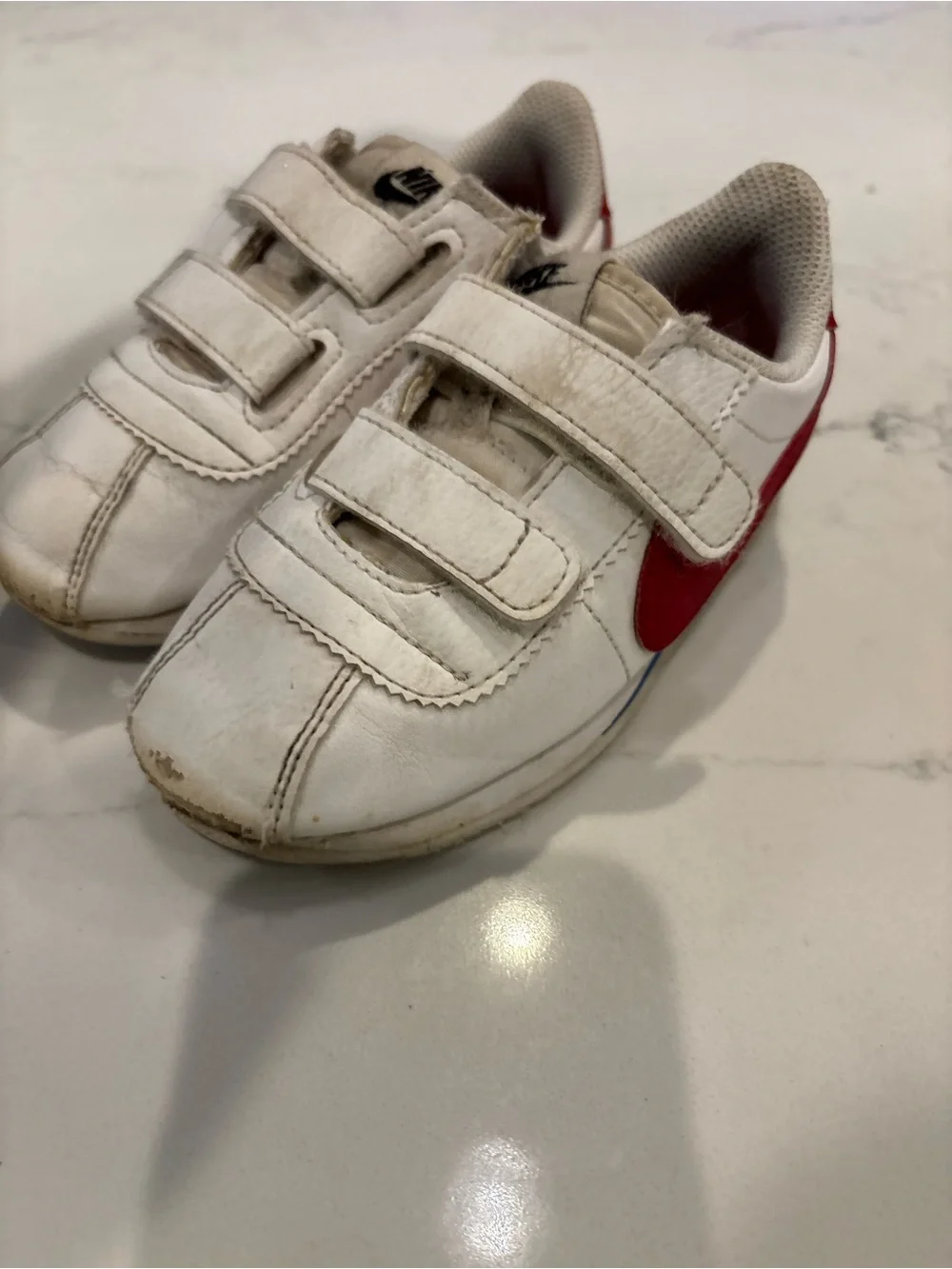 Nike Kids White Sneakers with Red Swoosh